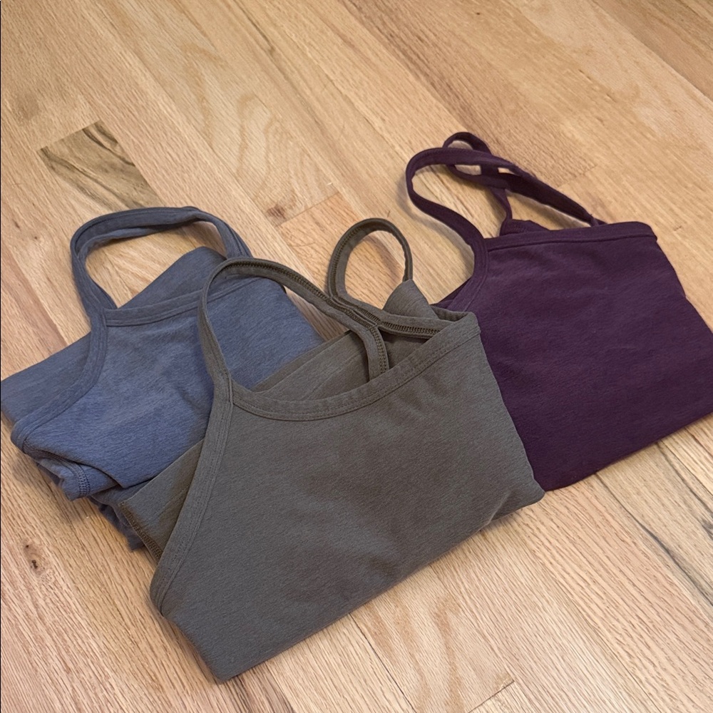 Set of Three beyond yoga Tank Tops in olive, gray and dark purple
